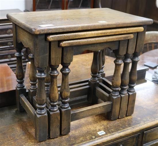 A nest of three oak tables W.55cm